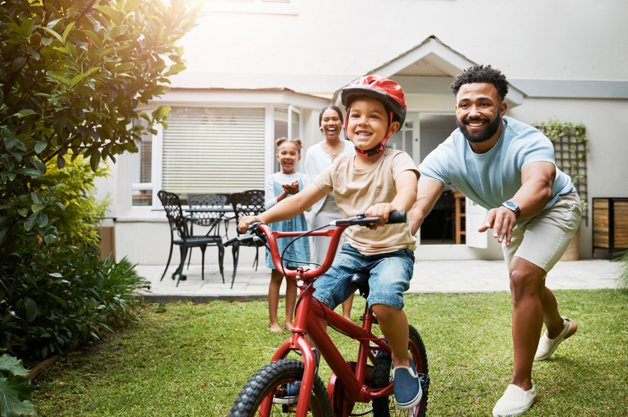 Boy learning to ride a bike